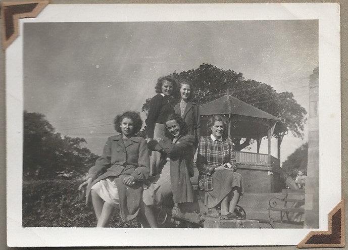 Five women star measurers on Observatory Hill in Sydney in front of the rotunda.